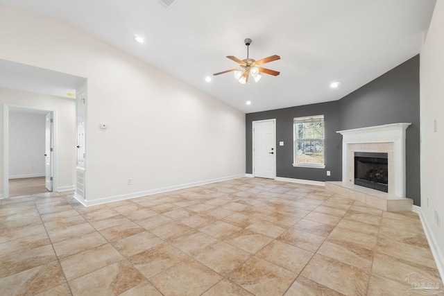 unfurnished living room featuring ceiling fan, a fireplace, and lofted ceiling