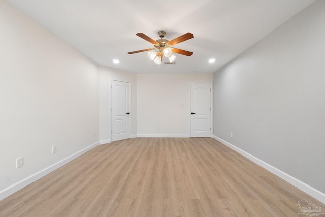 unfurnished room with ceiling fan and light wood-type flooring