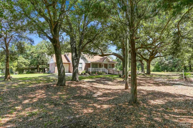 939 Avalon Blvd, Milton, FL 32583 - view of yard featuring covered porch