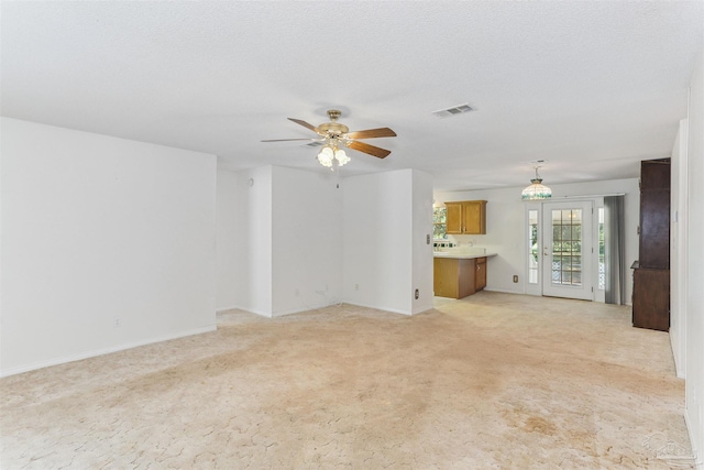939 Avalon Blvd, Milton, FL 32583 - unfurnished living room with light colored carpet and a ceiling fan