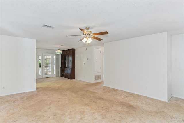 939 Avalon Blvd, Milton, FL 32583 - unfurnished living room featuring light carpet and a ceiling fan