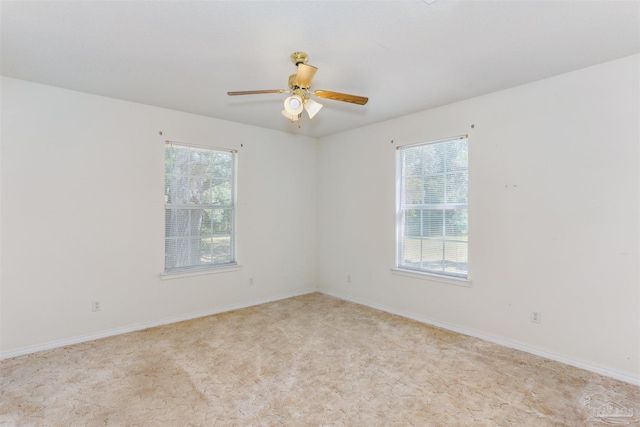 939 Avalon Blvd, Milton, FL 32583 - empty room featuring healthy amount of natural light, ceiling fan, and light carpet