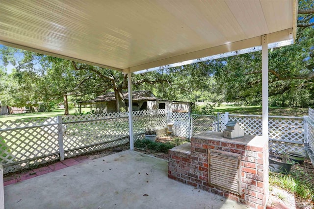 939 Avalon Blvd, Milton, FL 32583 - view of patio with view of wooded area