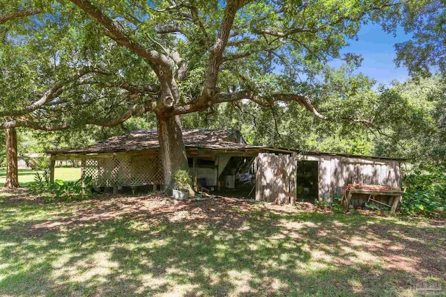 939 Avalon Blvd, Milton, FL 32583 - rear view of house with an outbuilding