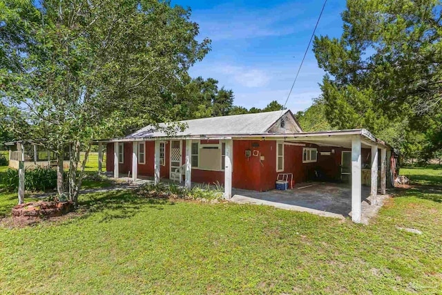 939 Avalon Blvd, Milton, FL 32583 - ranch-style house featuring a front lawn and an attached carport
