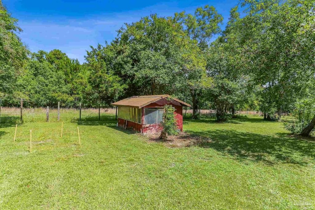 939 Avalon Blvd, Milton, FL 32583 - view of green lawn with an outbuilding