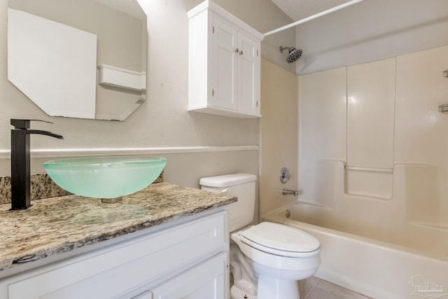 full bath featuring tub / shower combination, vanity, toilet, and tile patterned floors