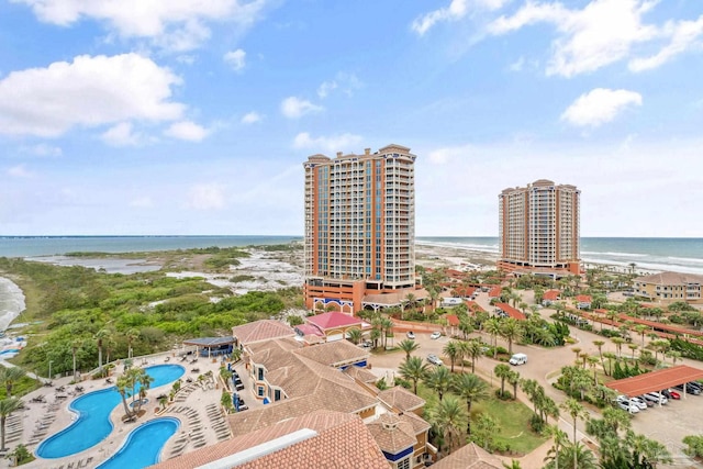 birds eye view of property with a view of the beach and a water view