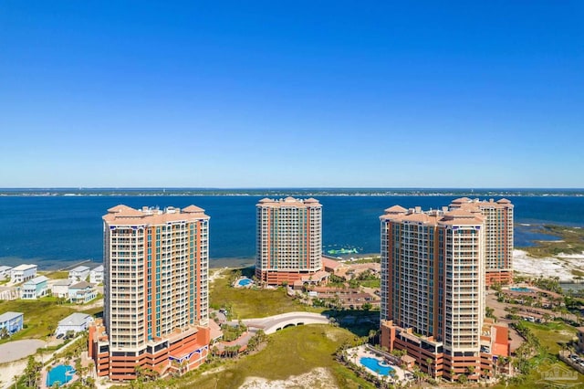 birds eye view of property with a water view