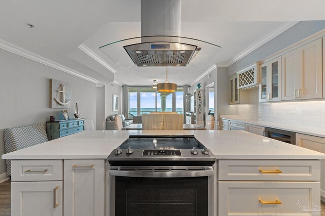 kitchen featuring electric stove, white cabinetry, crown molding, and hardwood / wood-style flooring