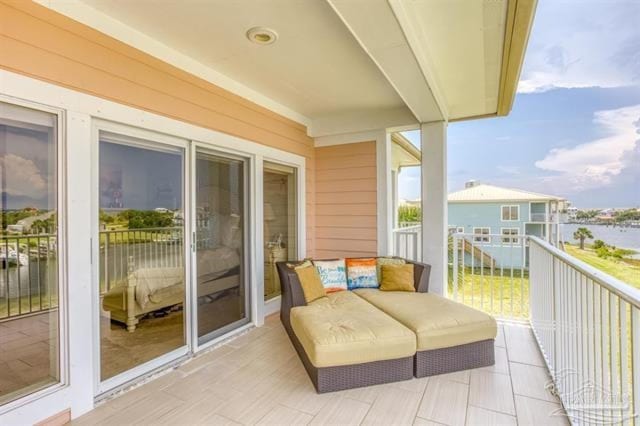 balcony featuring a water view