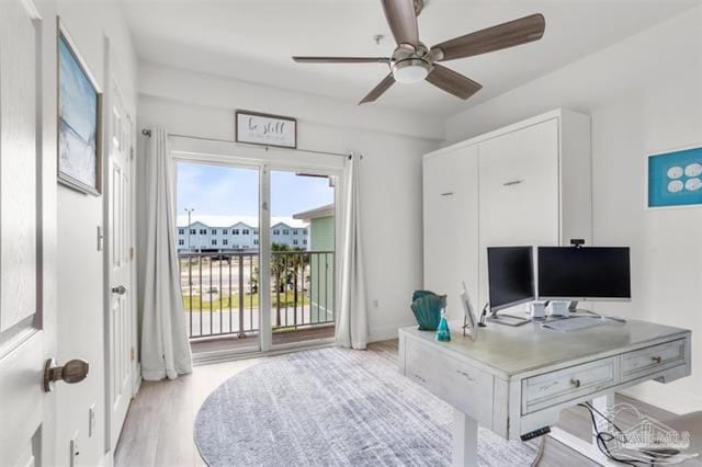 office featuring ceiling fan and light wood-style floors