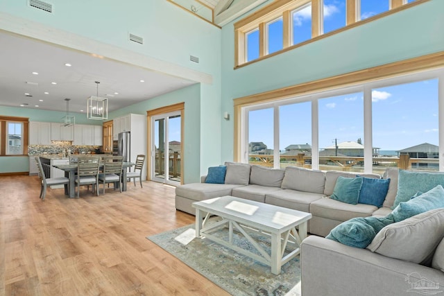 800 Via Deluna Dr, Pensacola Beach, FL 32561 - living area featuring a wealth of natural light, visible vents, and light wood-style floors