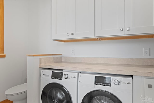 800 Via Deluna Dr, Pensacola Beach, FL 32561 - laundry room with cabinet space and washing machine and dryer