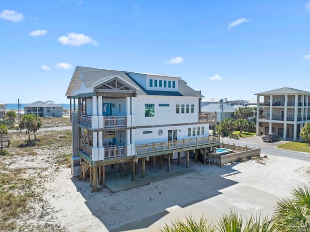 800 Via Deluna Dr, Pensacola Beach, FL 32561 - rear view of house with a balcony