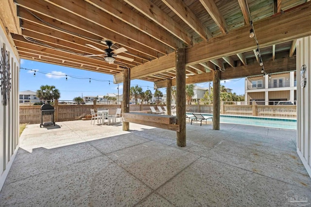 800 Via Deluna Dr, Pensacola Beach, FL 32561 - view of patio / terrace with grilling area, a fenced in pool, a ceiling fan, and fence