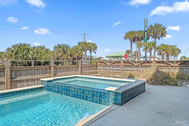 800 Via Deluna Dr, Pensacola Beach, FL 32561 - view of swimming pool with an in ground hot tub and a fenced backyard