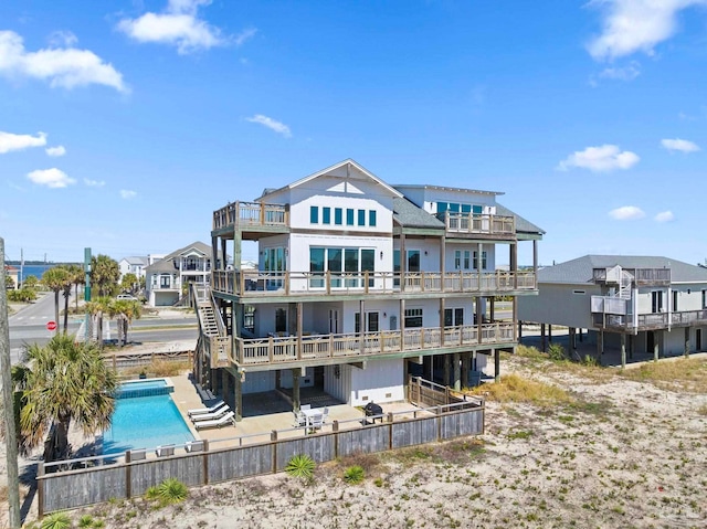 800 Via Deluna Dr, Pensacola Beach, FL 32561 - back of property featuring a community pool and a patio area