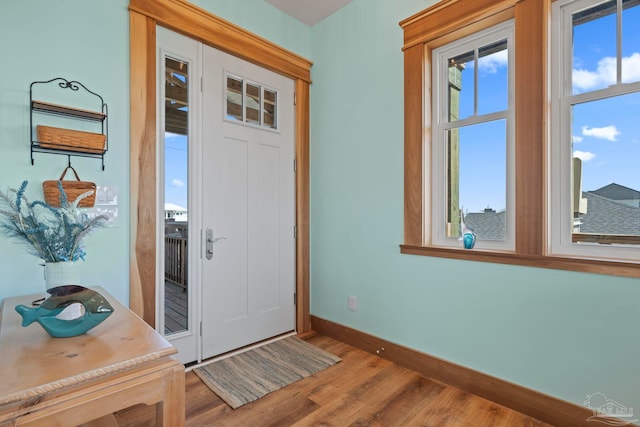 800 Via Deluna Dr, Pensacola Beach, FL 32561 - foyer featuring baseboards and wood finished floors