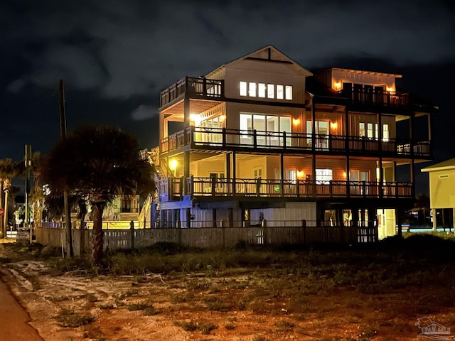800 Via Deluna Dr, Pensacola Beach, FL 32561 - back of house at twilight with fence