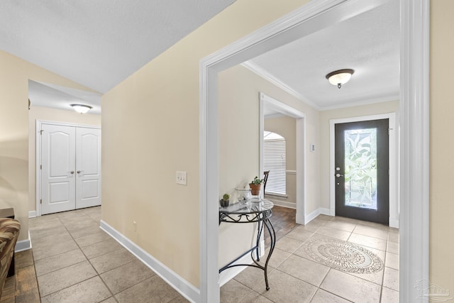 4621 Riley Rd, Milton, FL 32583 - entryway featuring light tile patterned floors and crown molding