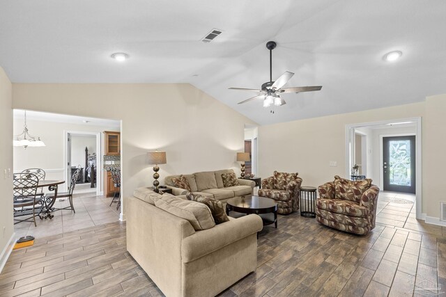 4621 Riley Rd, Milton, FL 32583 - living area with wood finished floors, vaulted ceiling, ceiling fan, and a chandelier