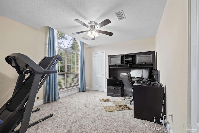 4621 Riley Rd, Milton, FL 32583 - office area featuring ceiling fan, light colored carpet, and a textured ceiling