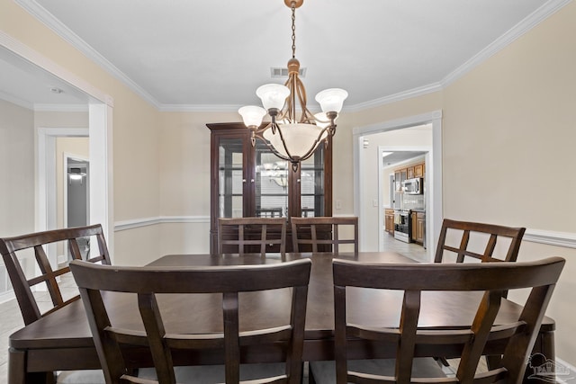 4621 Riley Rd, Milton, FL 32583 - dining area with a chandelier and ornamental molding