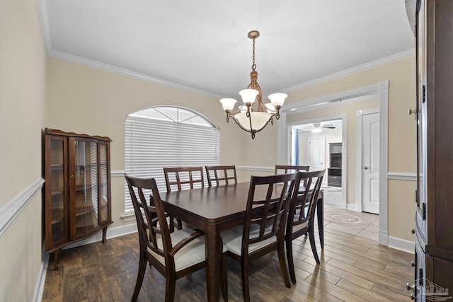 4621 Riley Rd, Milton, FL 32583 - dining space with a chandelier, wood finished floors, crown molding, and ceiling fan