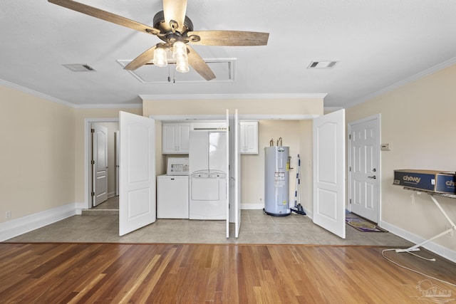 4621 Riley Rd, Milton, FL 32583 - unfurnished bedroom featuring electric water heater, washer and clothes dryer, light wood finished floors, ornamental molding, and ceiling fan