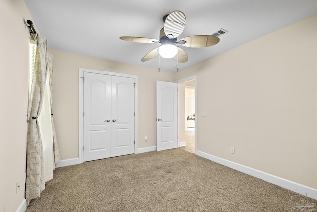 4621 Riley Rd, Milton, FL 32583 - unfurnished bedroom featuring carpet flooring, a closet, and a ceiling fan