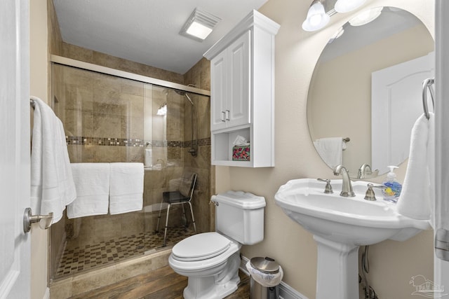 4621 Riley Rd, Milton, FL 32583 - full bathroom with a shower stall and wood finished floors
