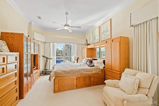 carpeted bedroom with ceiling fan, access to exterior, ornamental molding, and a textured ceiling