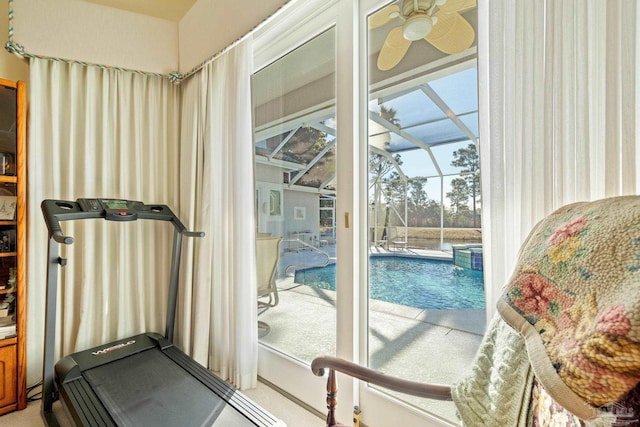 workout area with ceiling fan, carpet, and a pool