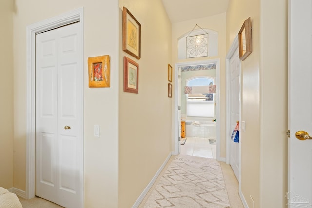 corridor featuring light tile patterned floors