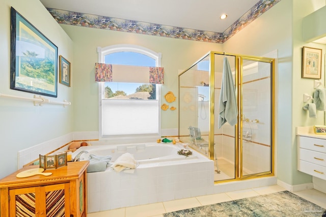 bathroom featuring tile patterned flooring and independent shower and bath