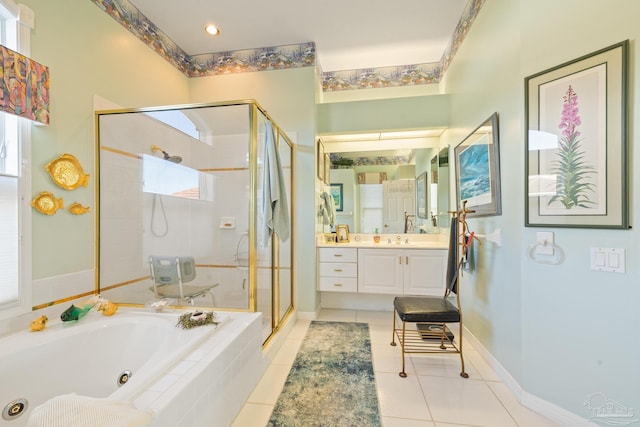 bathroom with vanity, tile patterned floors, and independent shower and bath