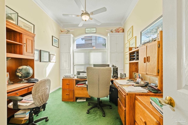 carpeted home office featuring ceiling fan and ornamental molding