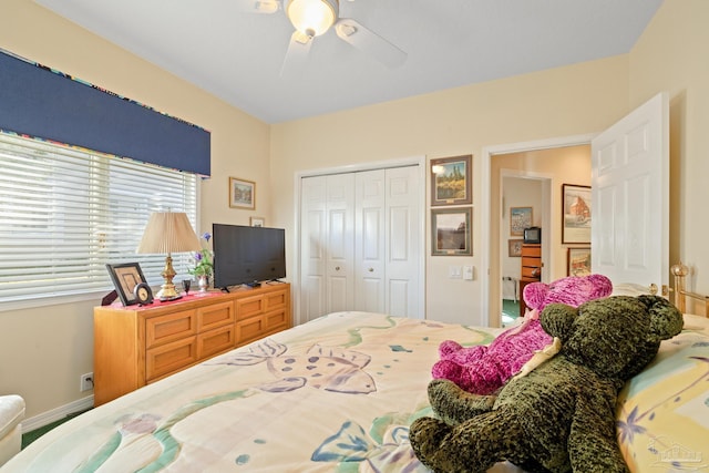 bedroom featuring ceiling fan and a closet