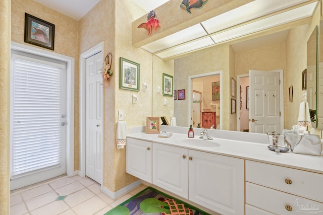 bathroom featuring tile patterned flooring and vanity