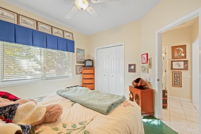 tiled bedroom featuring a closet and ceiling fan