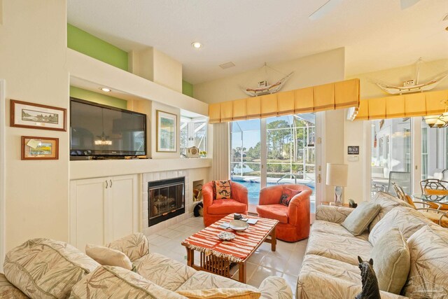 tiled living room featuring a tile fireplace