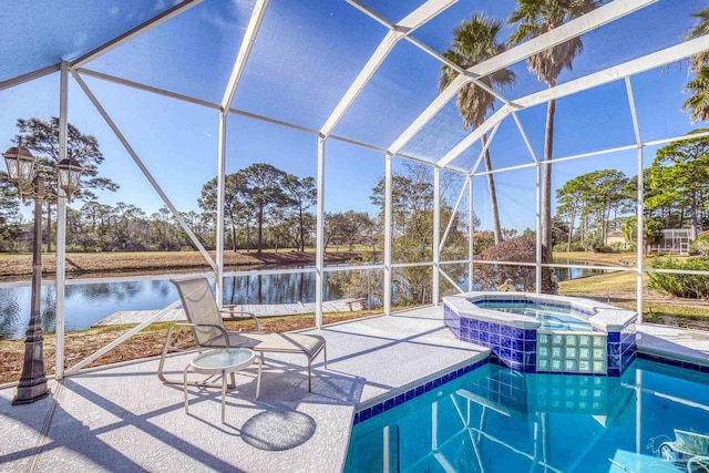 view of swimming pool featuring a lanai, an in ground hot tub, and a water view