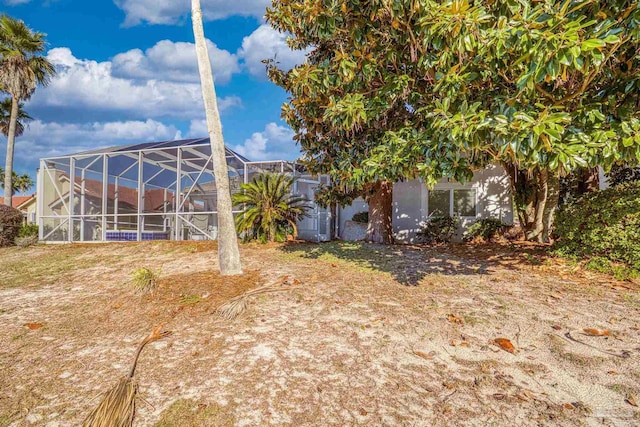 view of yard with a lanai