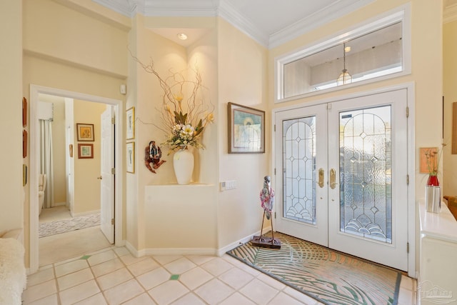 tiled foyer entrance featuring french doors and ornamental molding