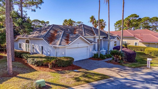 view of front facade featuring a front yard and a garage