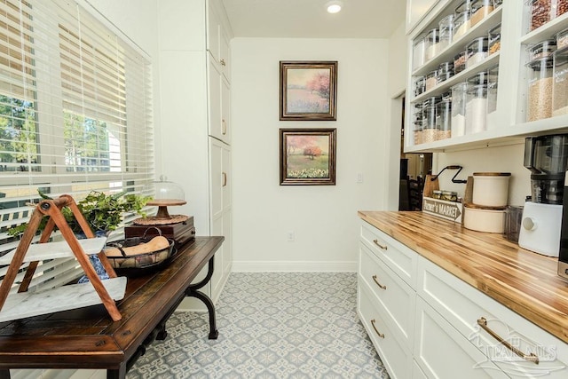 office space with light floors and baseboards