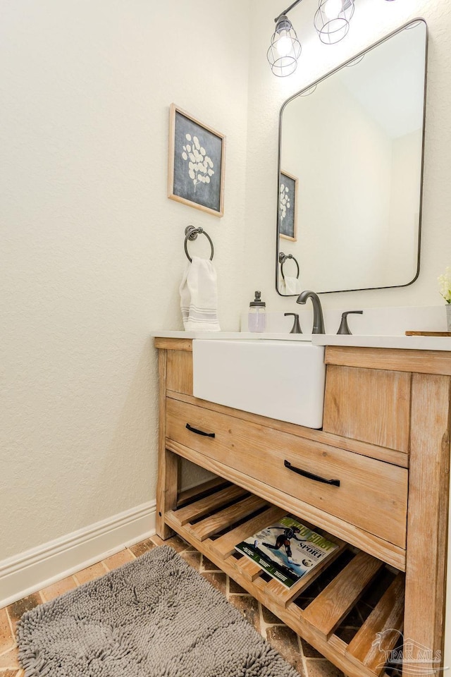 bathroom featuring vanity and baseboards