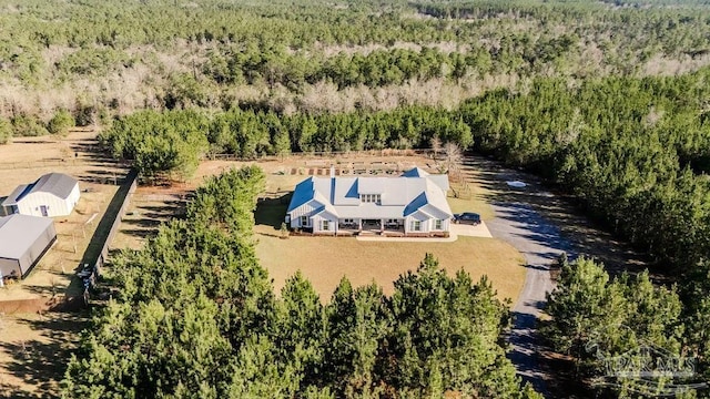 aerial view featuring a wooded view