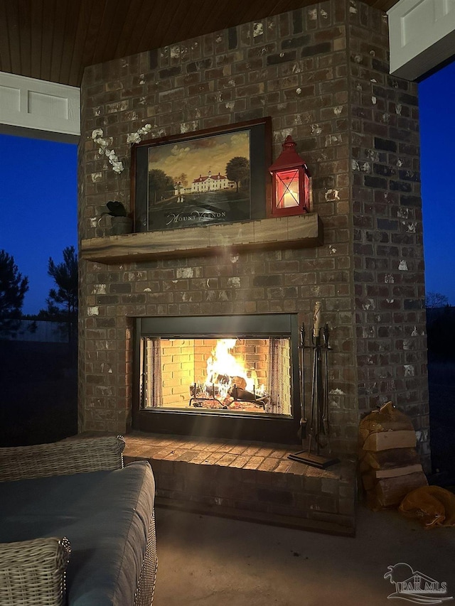 interior details featuring a fireplace and wooden ceiling